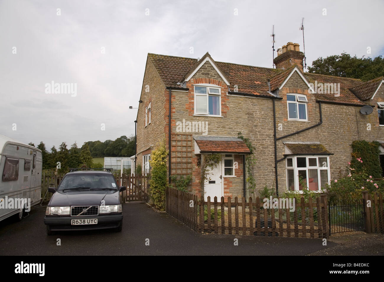 Modern house in Wincanton, Somerset, built from stone. Volvo car parked
