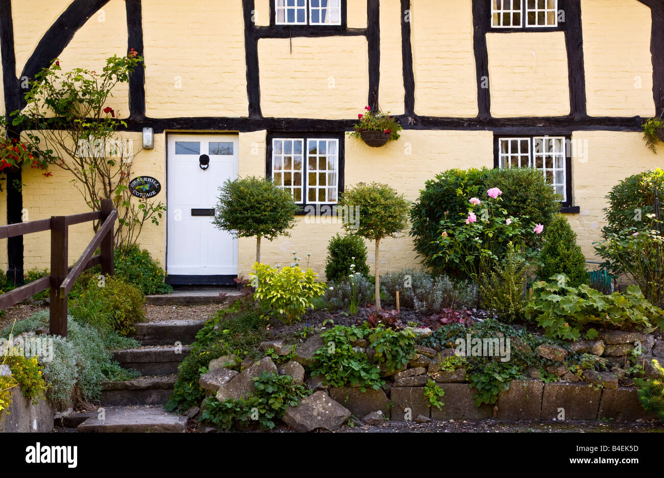 Front view close-up of a typical English timber framed whitewashed Tudor rural country cottage in All Cannings, Wiltshire, UK Stock Photo