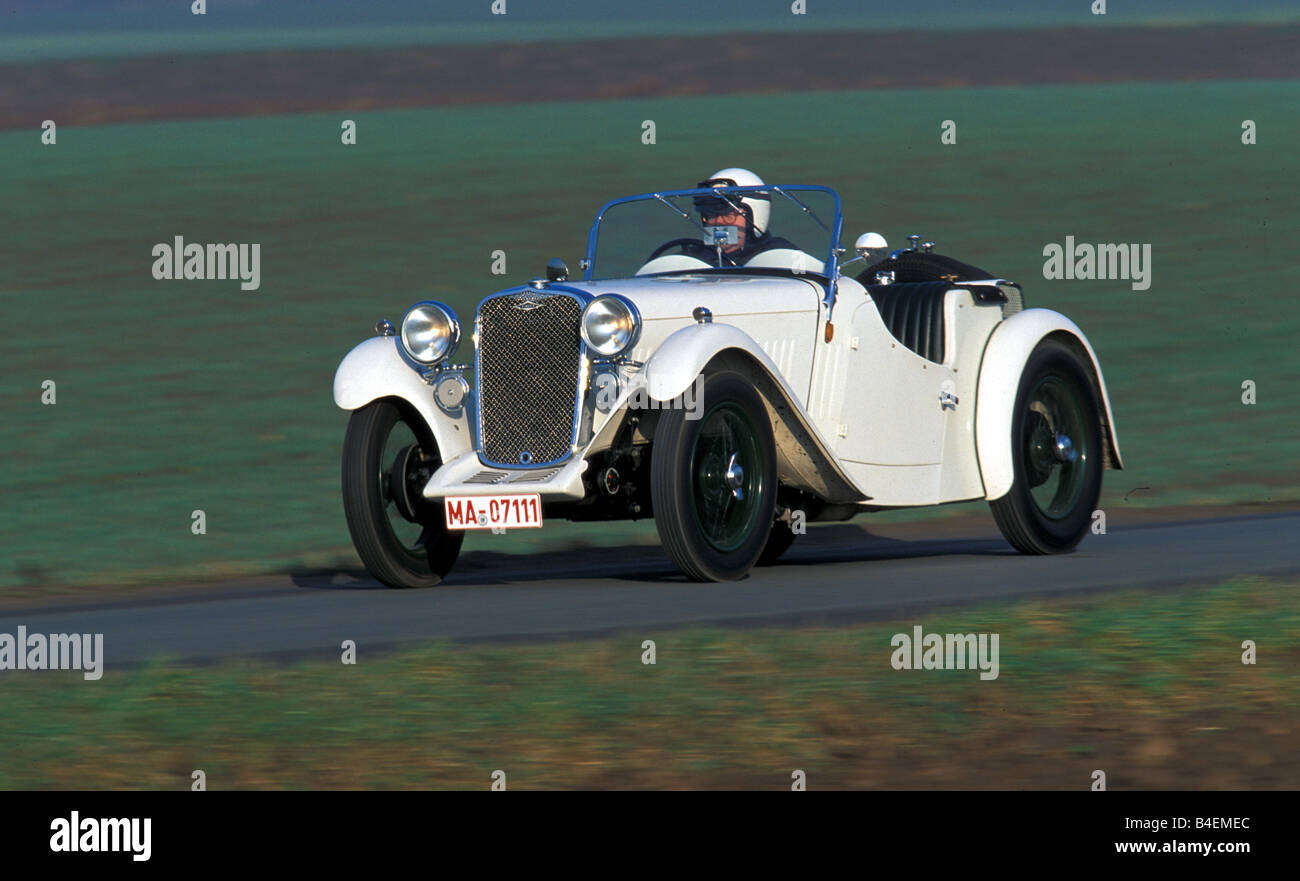 Car, Singer, vintage car, approx. model year 1933, Roadster, white, vintage car, 1930s, thirties,   driving, diagonal front, fro Stock Photo