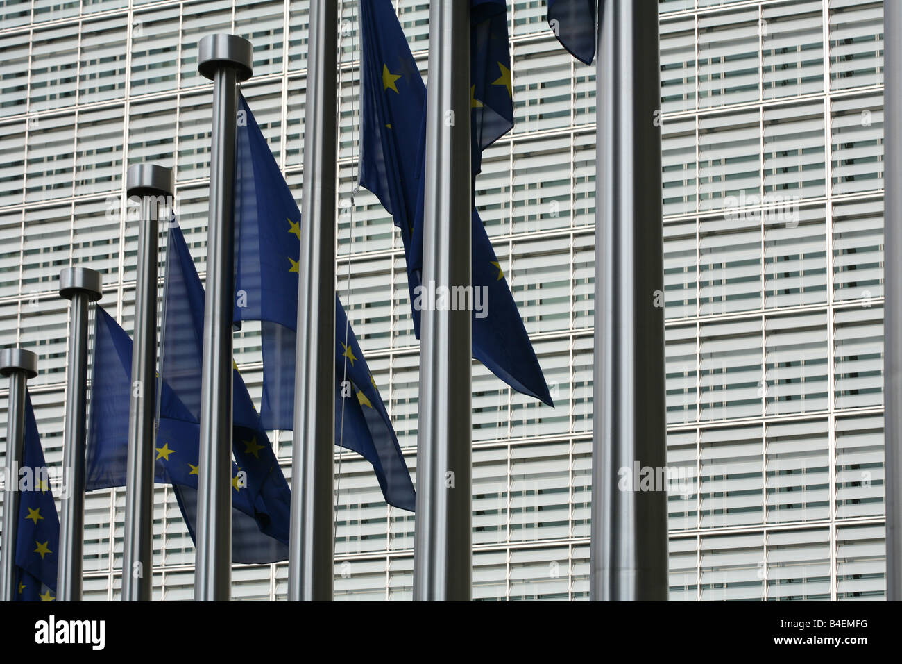 European flags in the wind fronting the Berlaymont building in Brussels