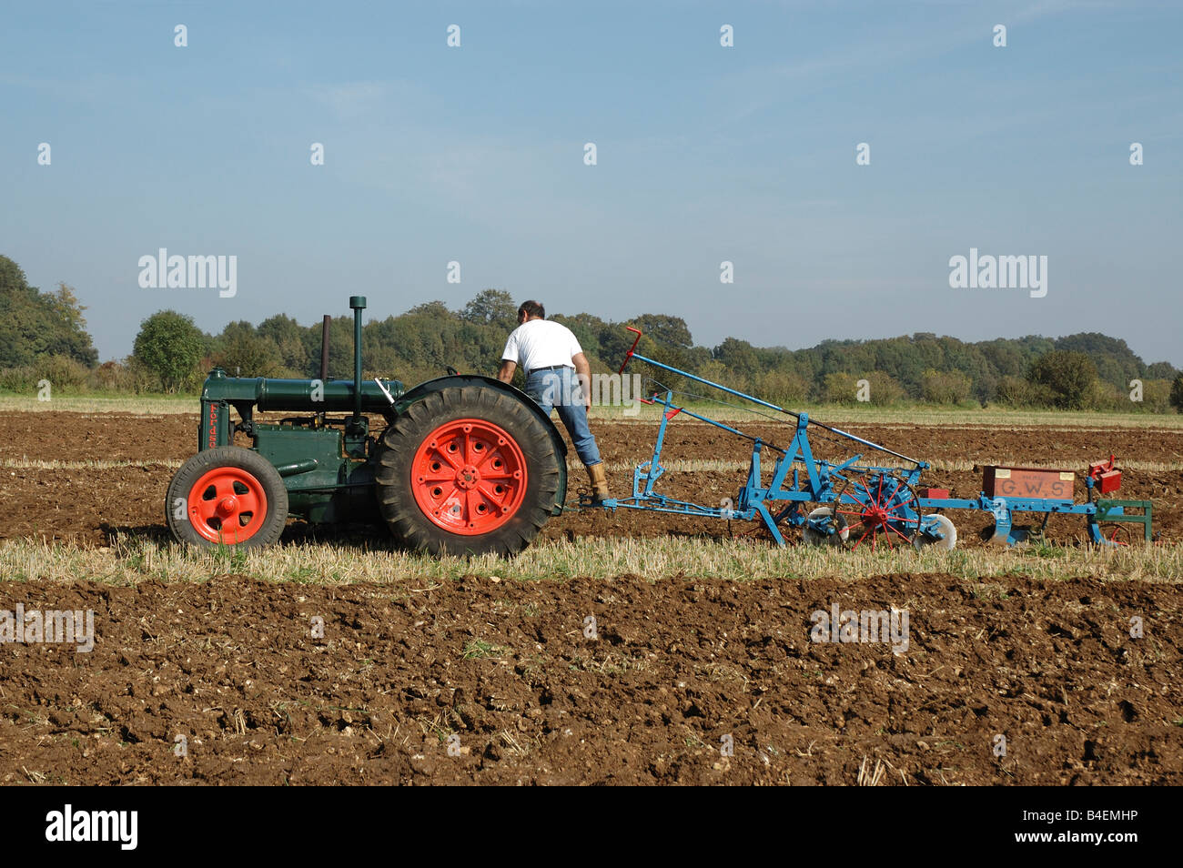 Tractor in a field Stock Photo - Alamy