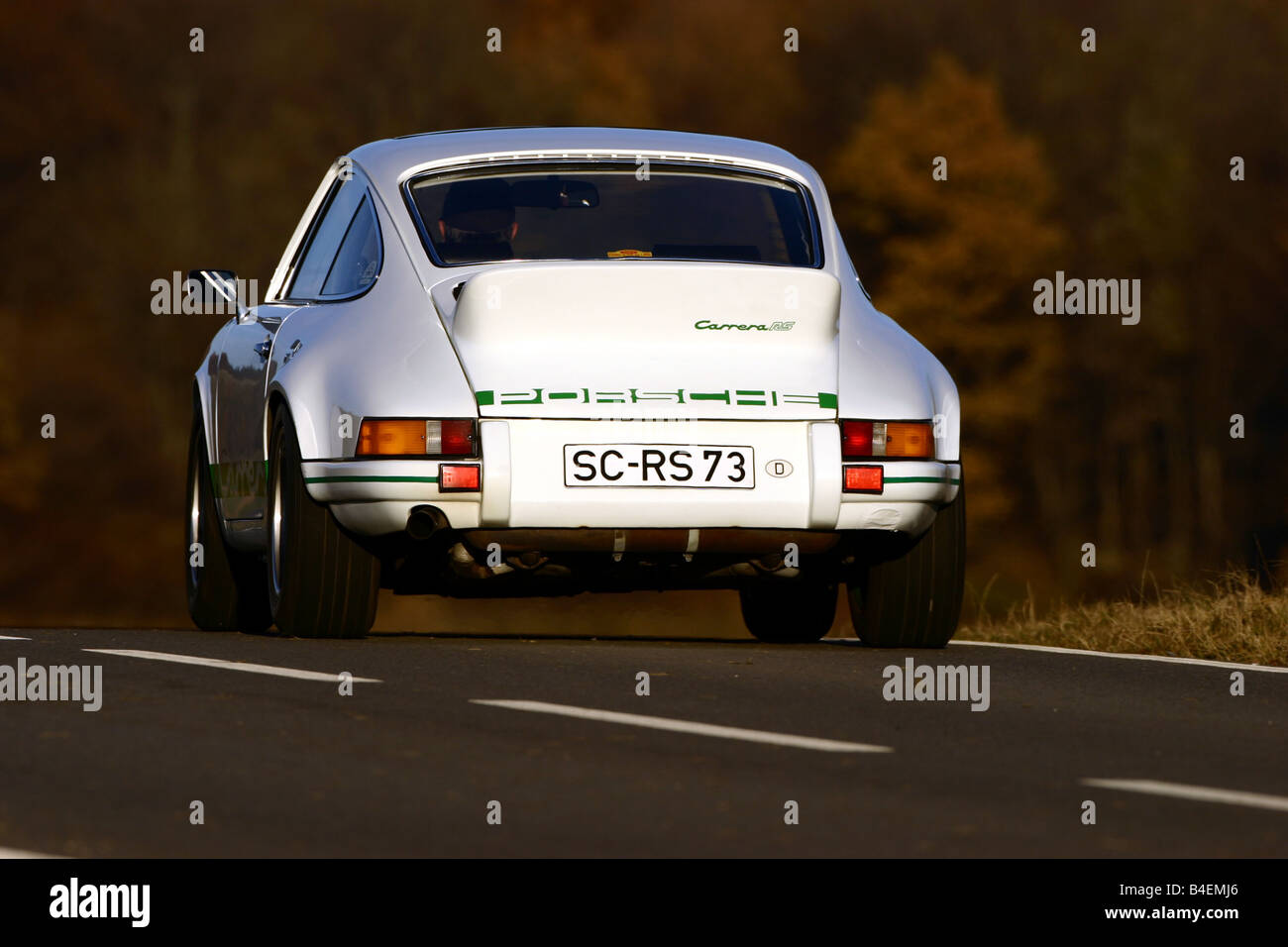 Car, Porsche 911 Carrera 2.7 RS, sports car, white, model year 1973, Coupé,  Coupe, old car, driving, diagonal back, back view, r Stock Photo - Alamy