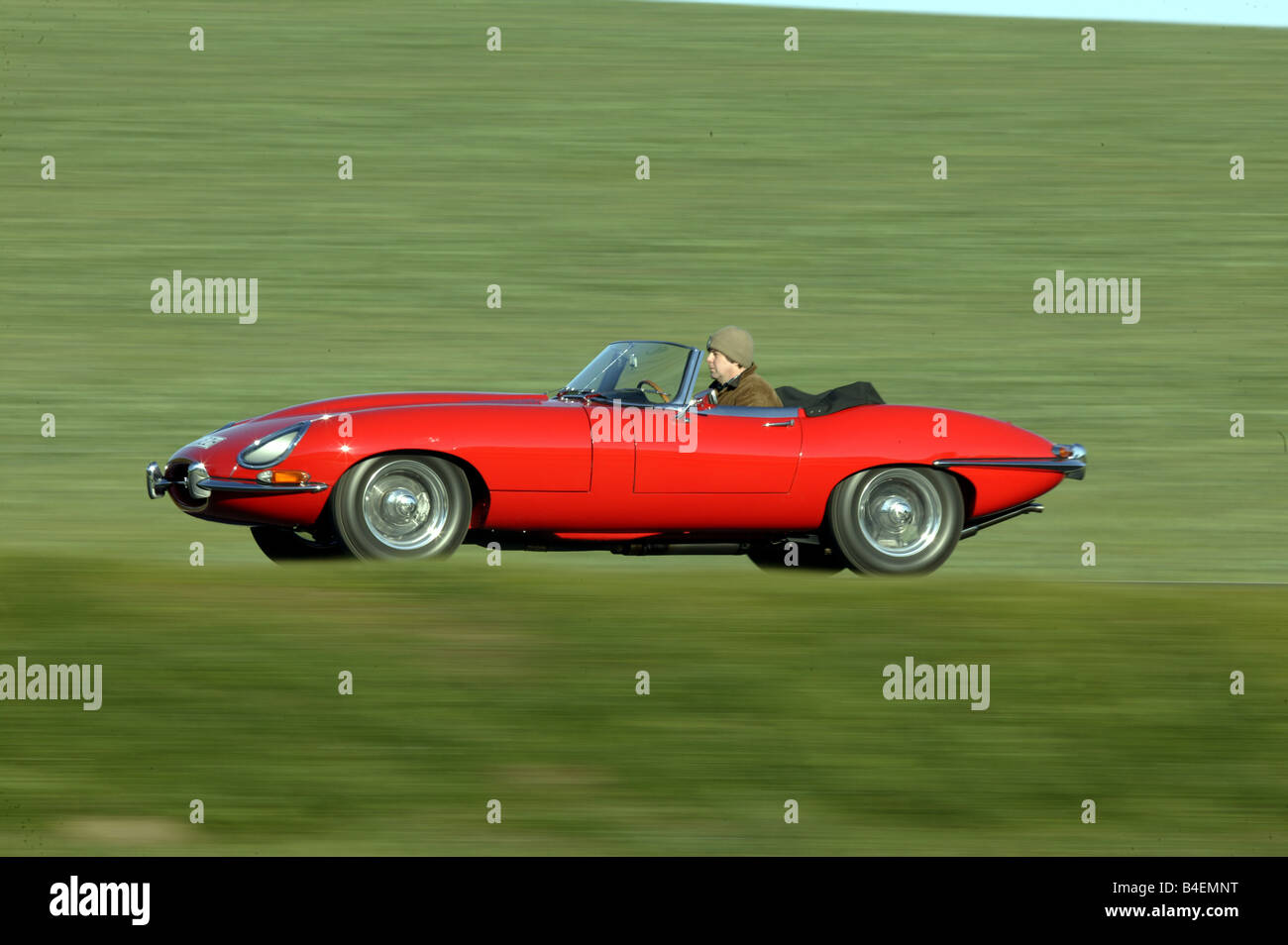 Car, Jaguar E-Type S1 4.2, model year 1965, convertible, vintage car, 1960s, sixties, red, 265 PS, convertible top, open, drivin Stock Photo
