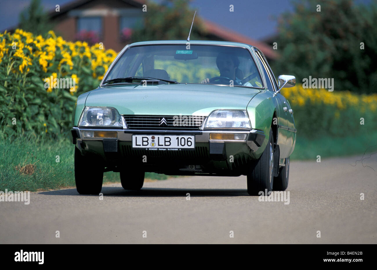 Car, Citroen CX 2400 Pallas, model year 1974-1983, old car, 1970s, seventies,  1980s, eighties, green, driving, diagonal front, Stock Photo