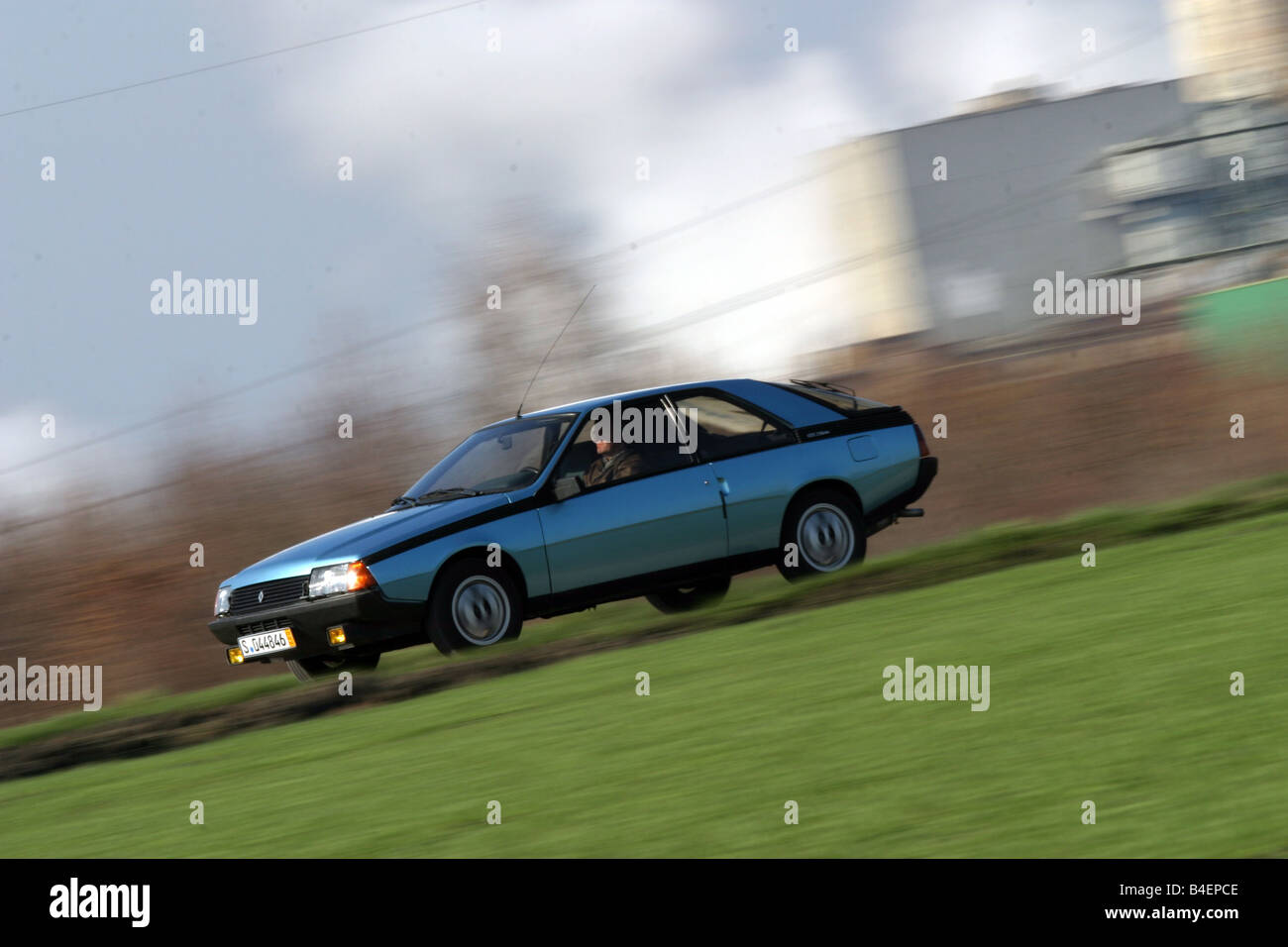Car, Renault Fuego, model year approx. 1984, blue, old car, 1980s, eighties, driving, diagonal front, front view, side view, roa Stock Photo