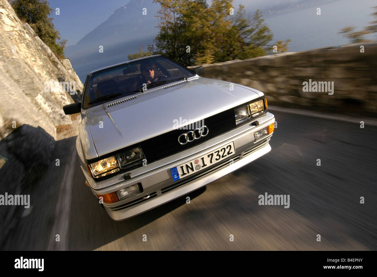 Car, Audi Quattro, model year 1981-1991, silver, old car, sedan, driving,  diagonal front, front view, road, country road, photog Stock Photo - Alamy