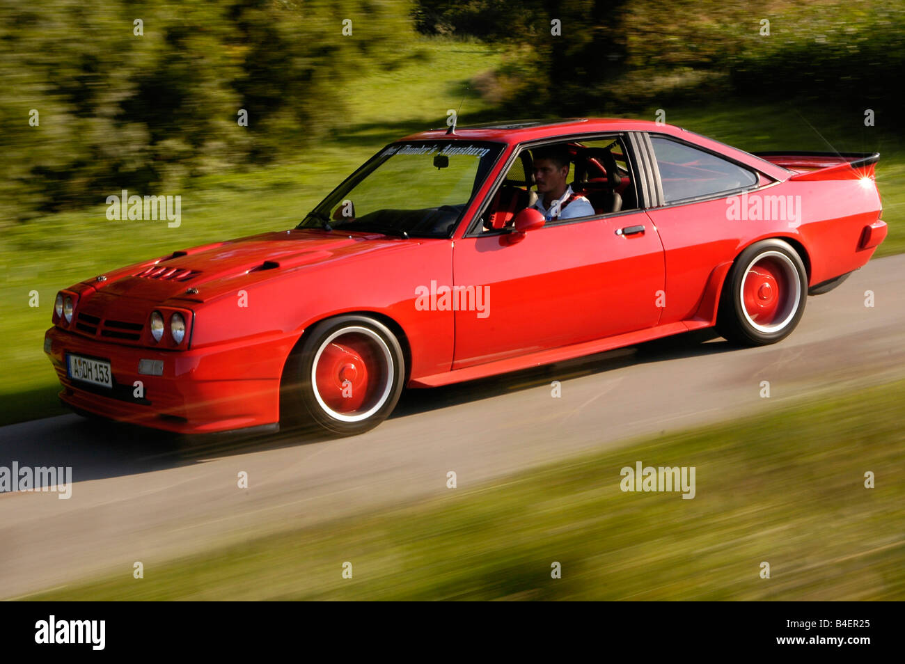 Car, Opel Manta B, model year 1983, red, Coupé, Coupe, old car, 1980s,  eighties, driving, side view, road, country road, photogr Stock Photo -  Alamy