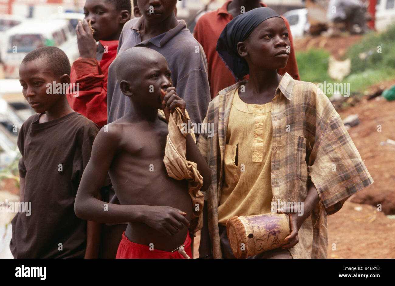 Group of homeless boys glue sniffing in Kampala, Uganda, Africa Stock Photo