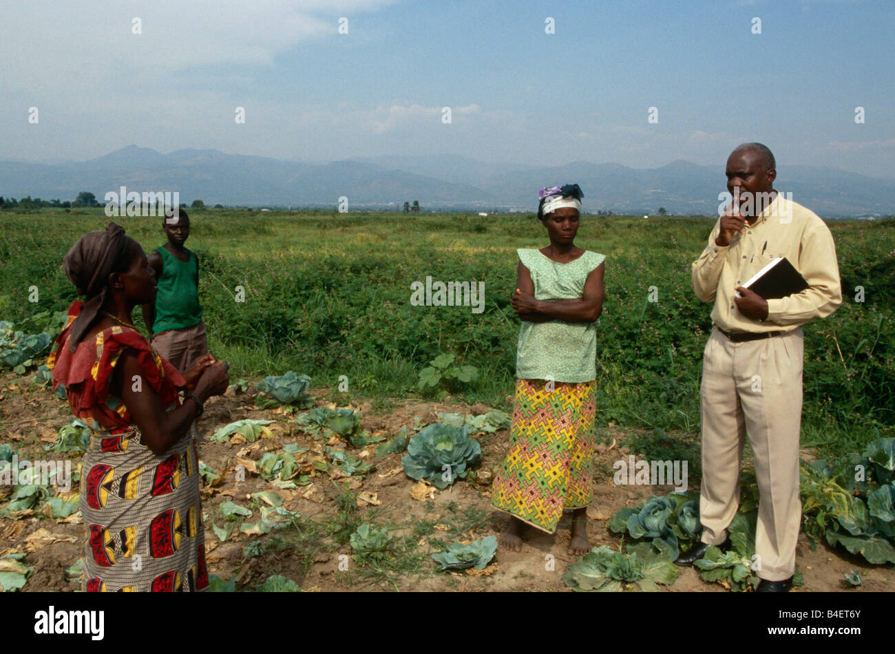 Officer Discussing Agriculture Project With Farmer Uganda Stock Photo officer-discussing-agriculture-project-with-farmer-uganda-stock-photo