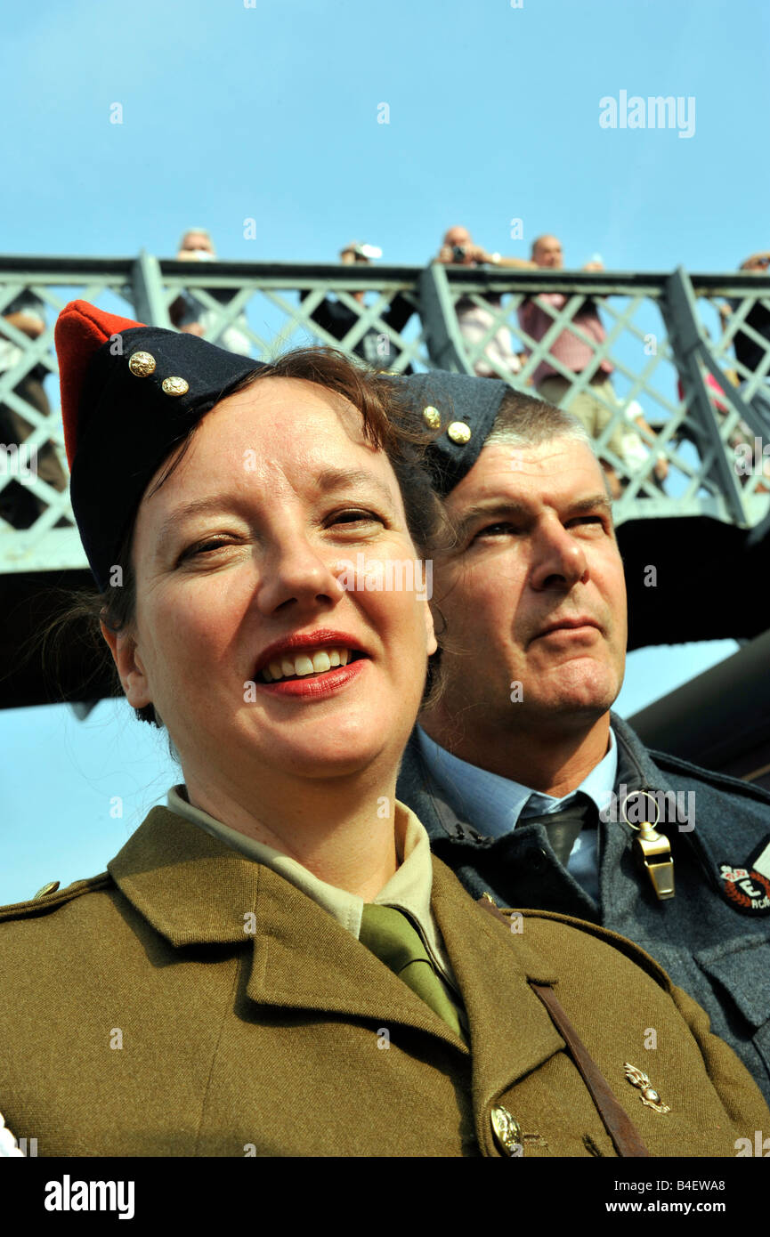 man and woman dressed in military uniform from 1940 s era at 1040 s day at Weybourne railway station Norfolk England Stock Photo