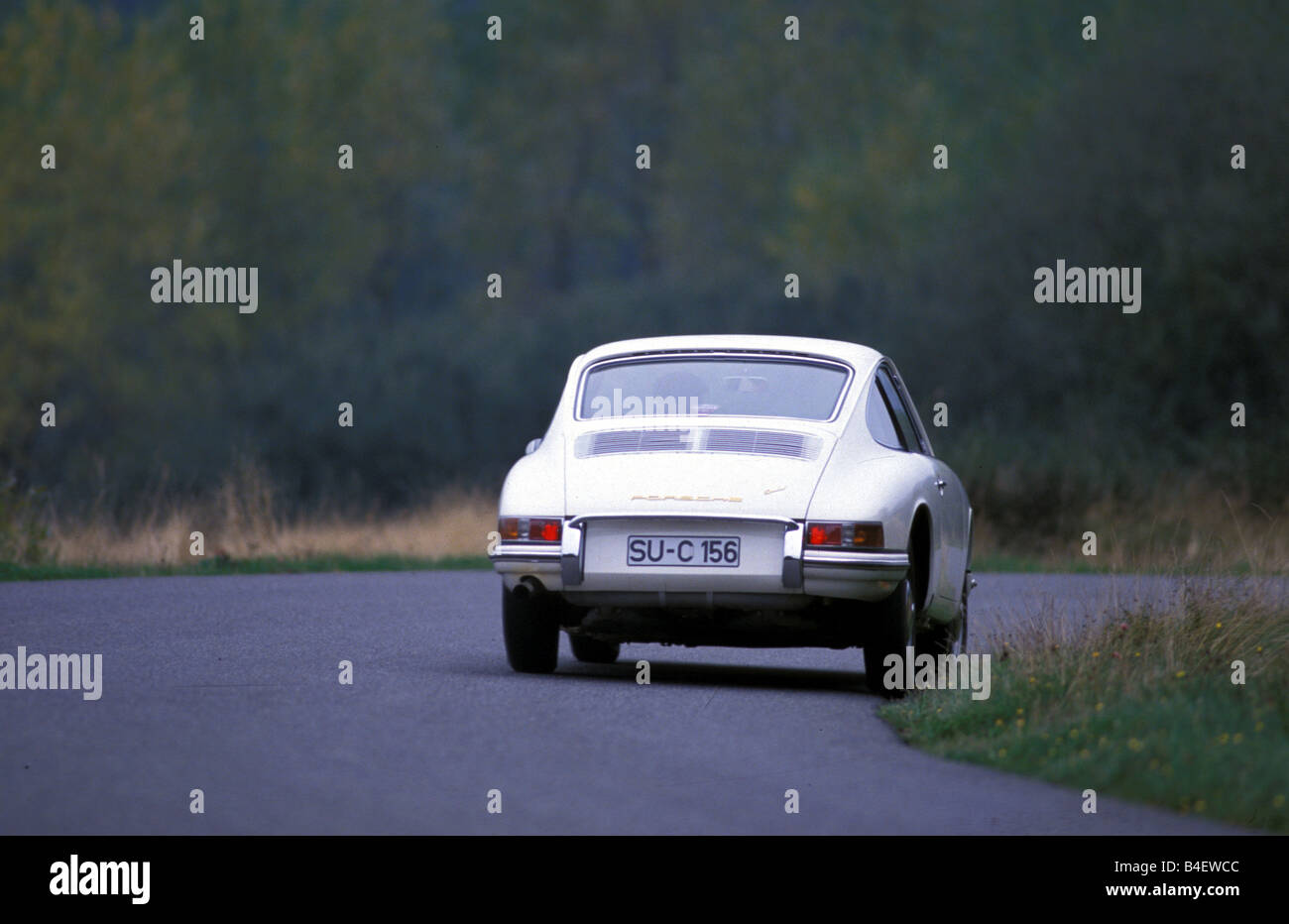 Car, Porsche 911, sports car, Coupé, Coupe, model year 1964, vintage car, 1960s, sixties, white, driving, diagonal back, back vi Stock Photo