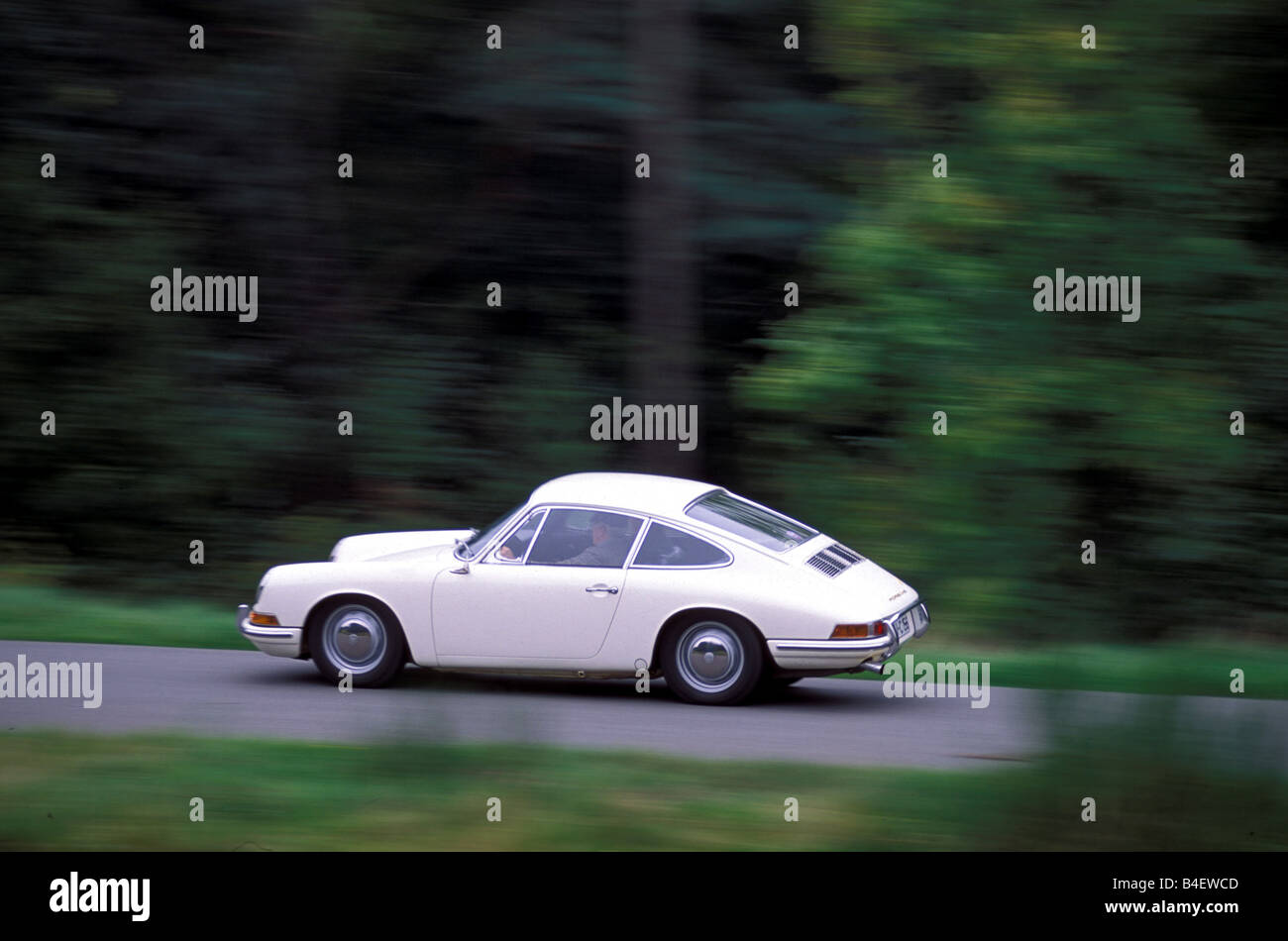 Car, Porsche 911, sports car, Coupé, Coupe, model year 1964, vintage car, 1960s, sixties, white, driving, diagonal back, side vi Stock Photo