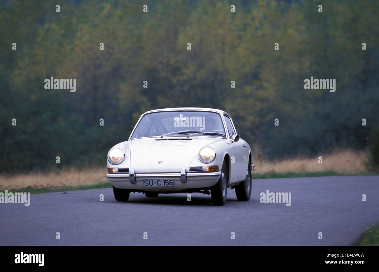 Car, Porsche 911, sports car, Coupé, Coupe, model year 1964, vintage car, 1960s, sixties, white, driving, diagonal front, front Stock Photo