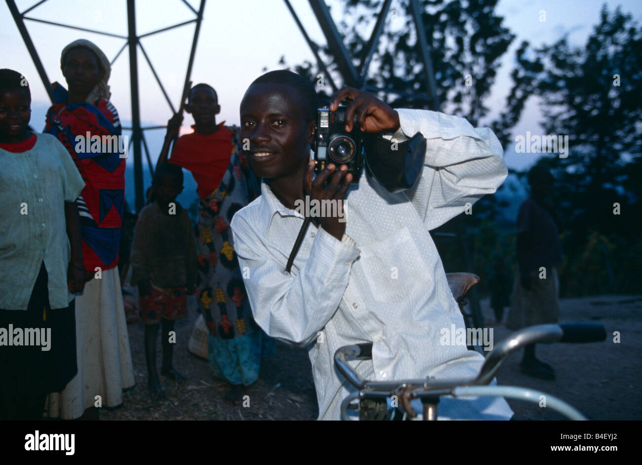 Man posing with a camera in Rwanda Stock Photo Alamy