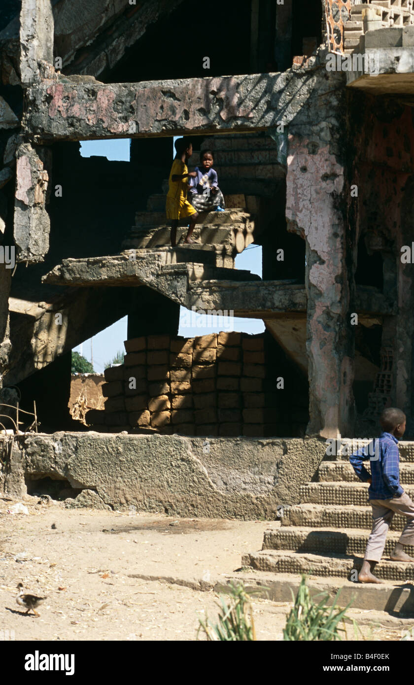 Homeless children in a war-destroyed building in Angola. Stock Photo