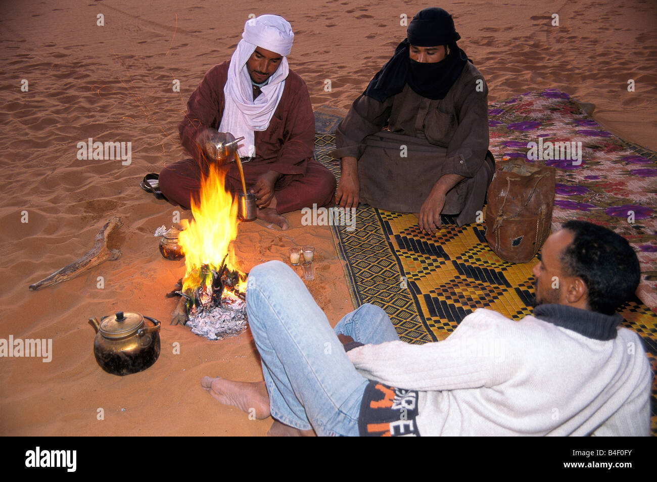 Locals making green tea in an encampment in the Sahara Desert, Libya