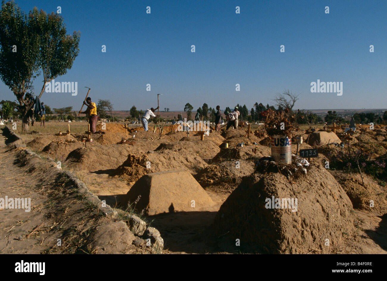 Civil war aftermath, men digging graves in cemetery, Angola, Africa Stock Photo