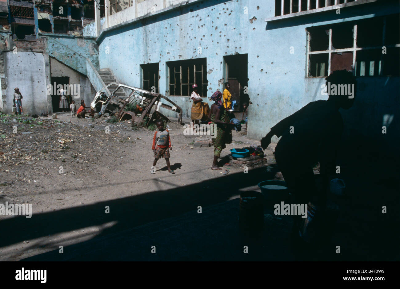 Displaced people sheltering in damaged building in war-ravaged Angola Stock Photo