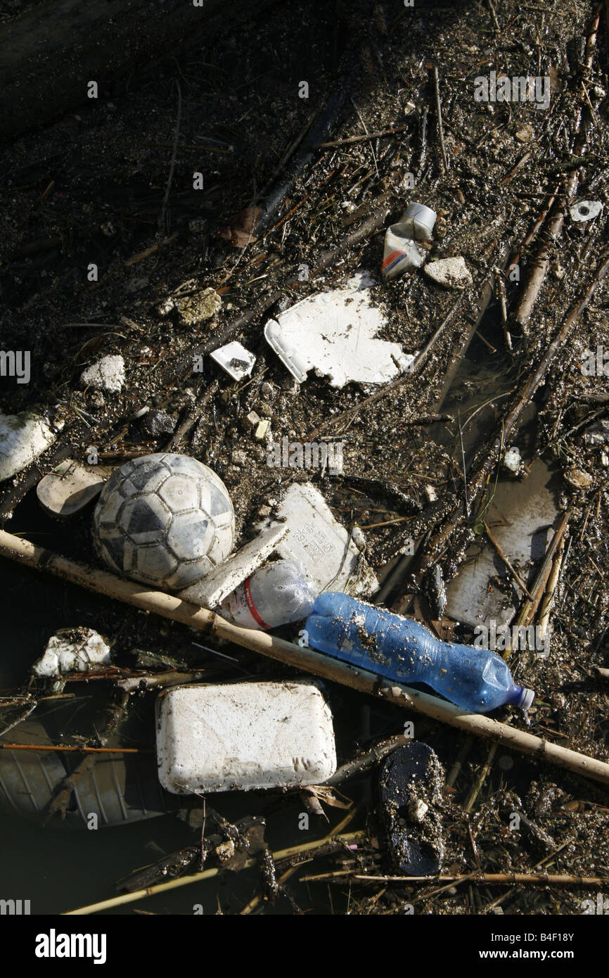 rubbish floating on polluted river surface Stock Photo - Alamy