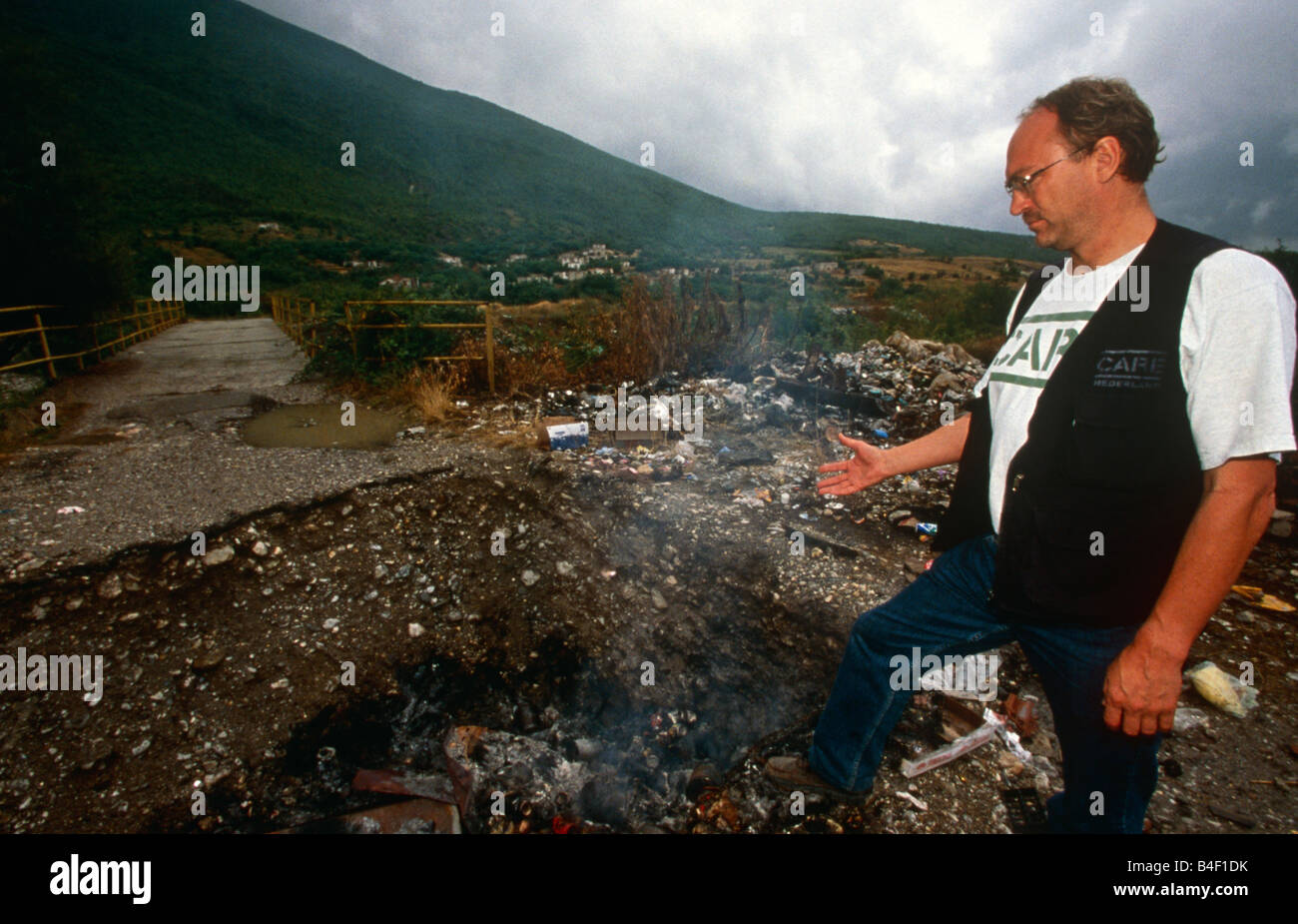A CARE worker at a destroyed village in Kosovo. Stock Photo