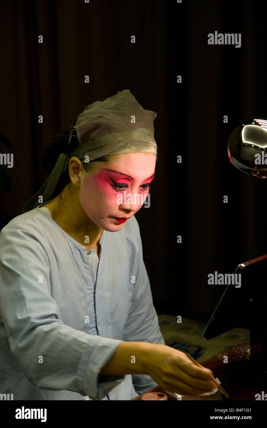 A Beijing Opera Performer applies makeup Stock Photo - Alamy