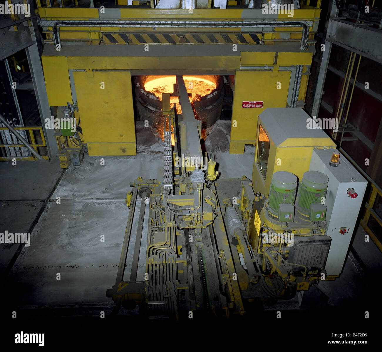 Skimming Slag from Molten Steel Stock Photo