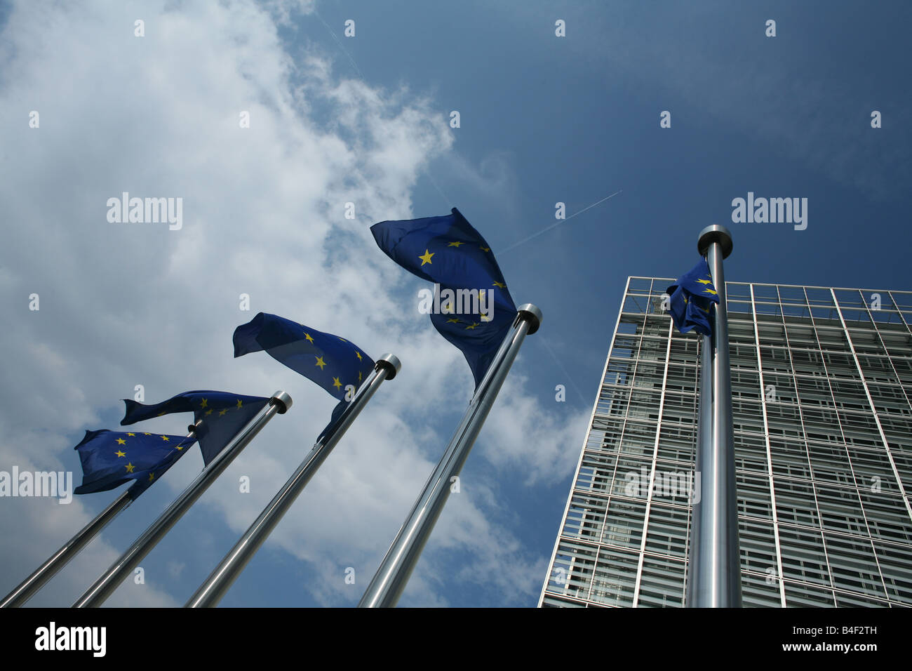 European flags in the wind fronting the Berlaymont building in Brussels