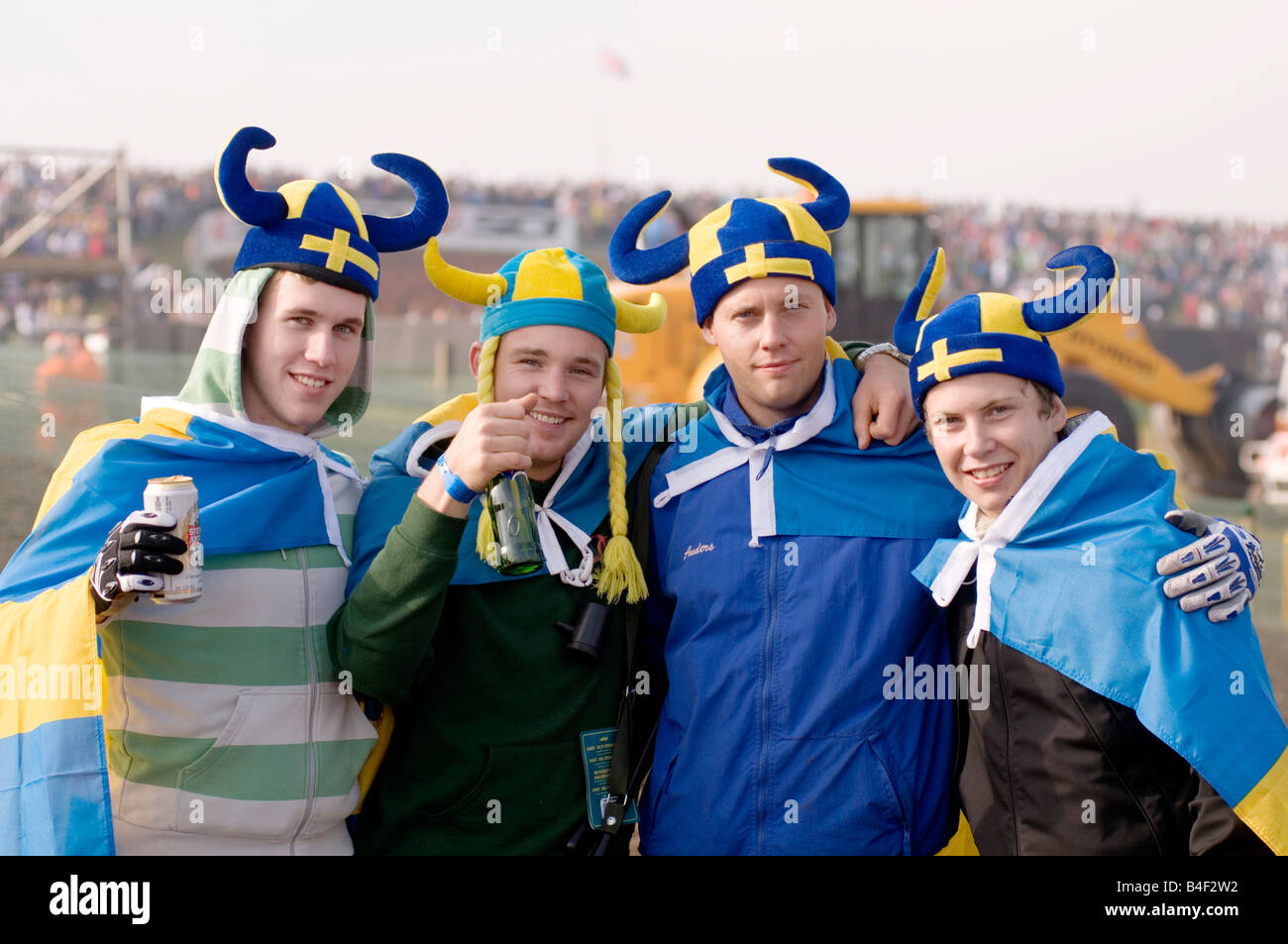 swedish fans spectators sweden nation pride flag yellow and blue at sporting event viking helmet