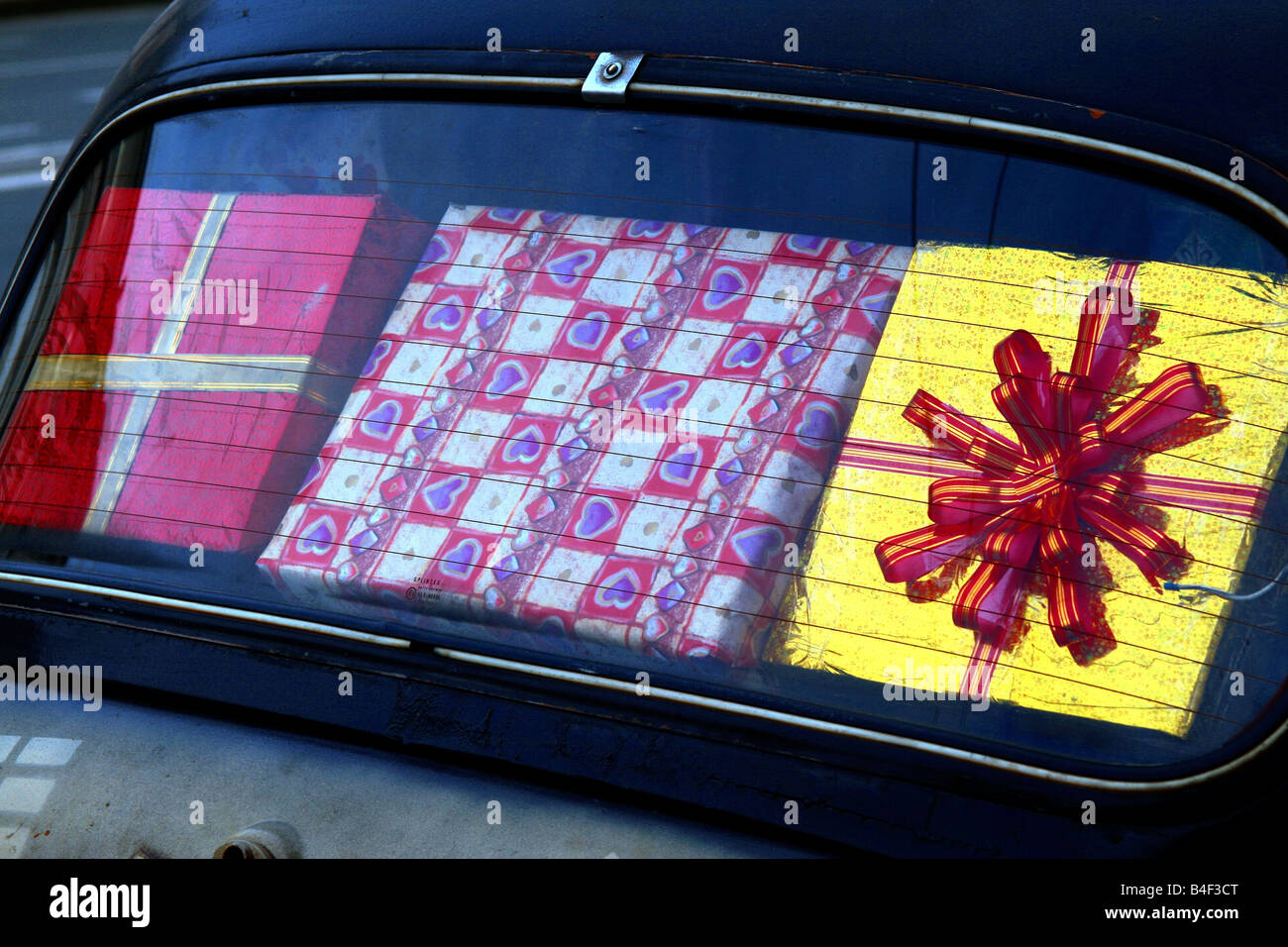 Colorful wrapped gift boxes in an old (antique) car Stock Photo - Alamy