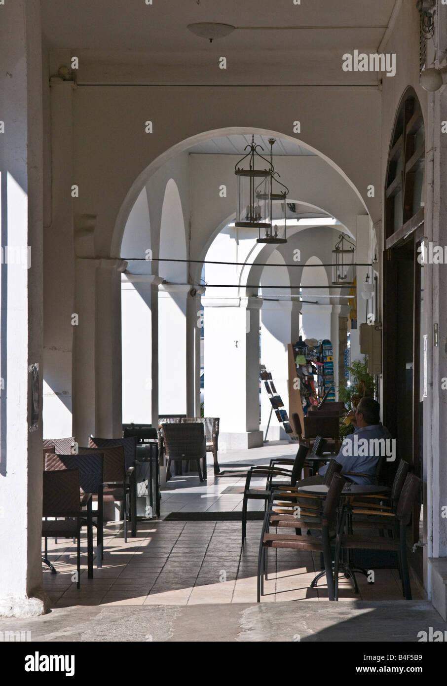 A cafe under the arches in the main square in the town of Pylos Messinia Southern Peloponnese Greece Stock Photo