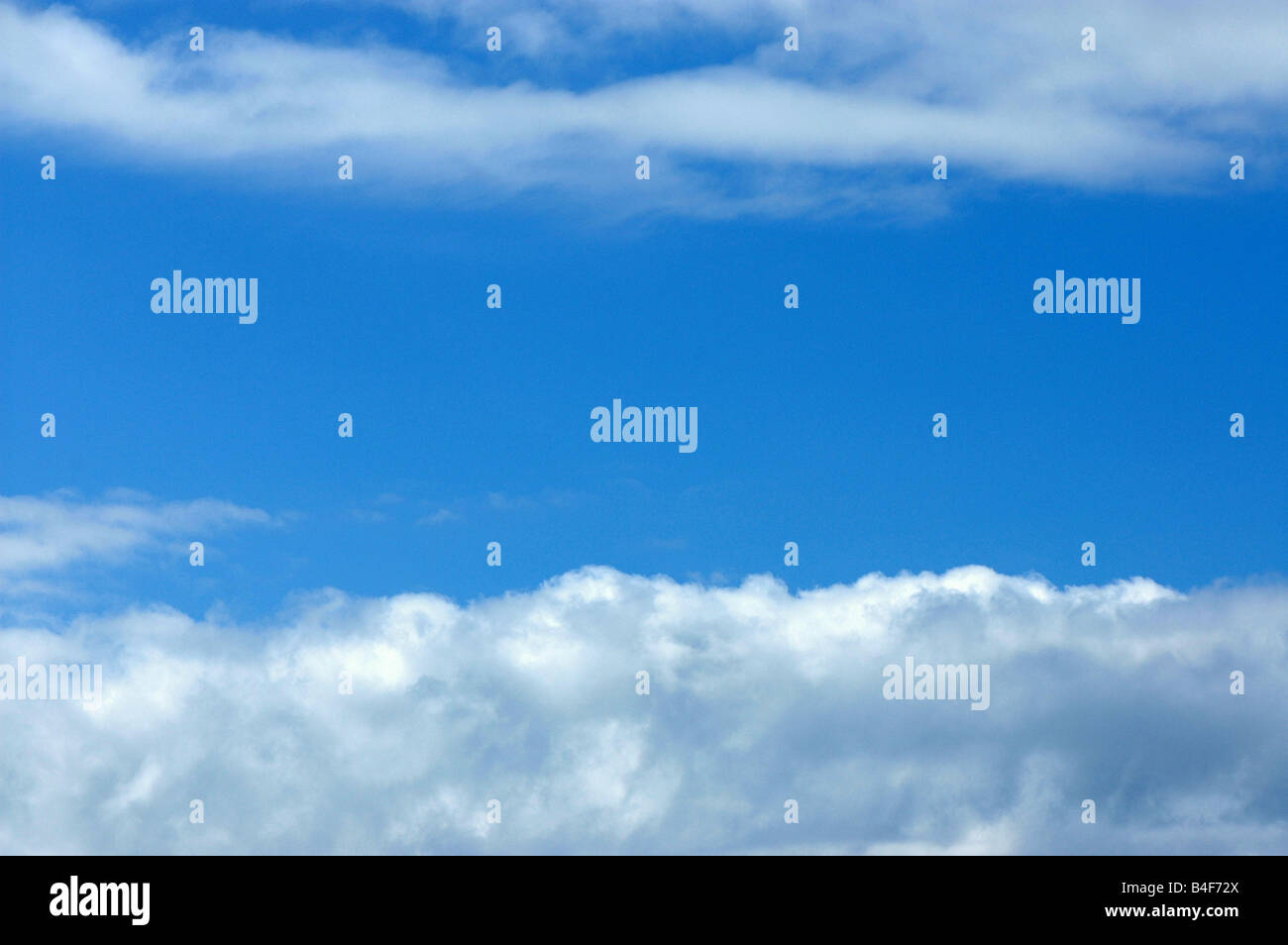 Some white clouds against the blue sky Stock Photo - Alamy