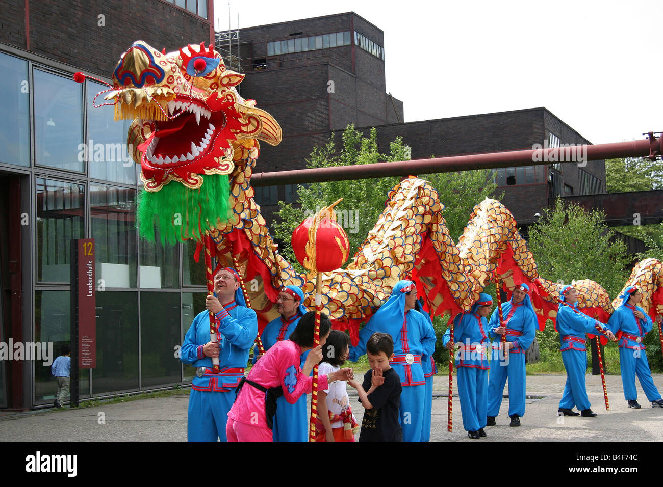 dragon dance - performers with the dragon in a row Stock Photo