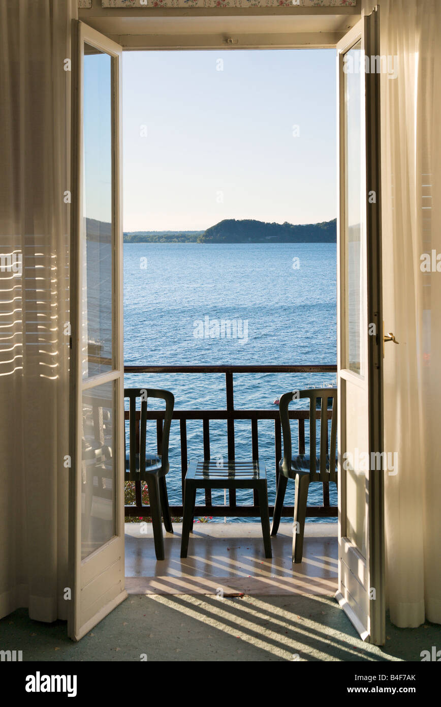 View over Lake Maggiore from a lakefront hotel room, Belgirate, Lake Maggiore, Italy Stock Photo