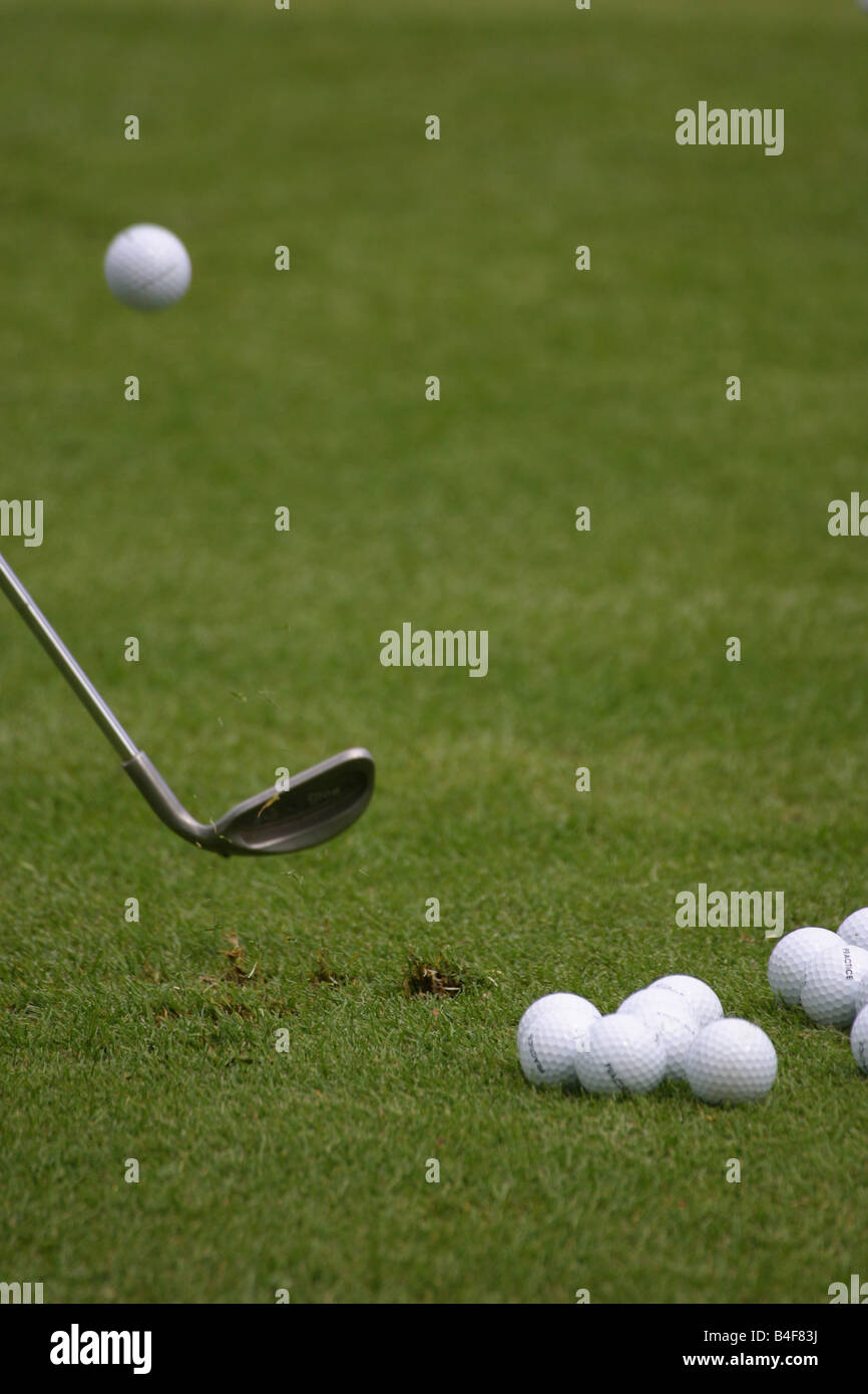 Golf club chipping a ball Stock Photo Alamy