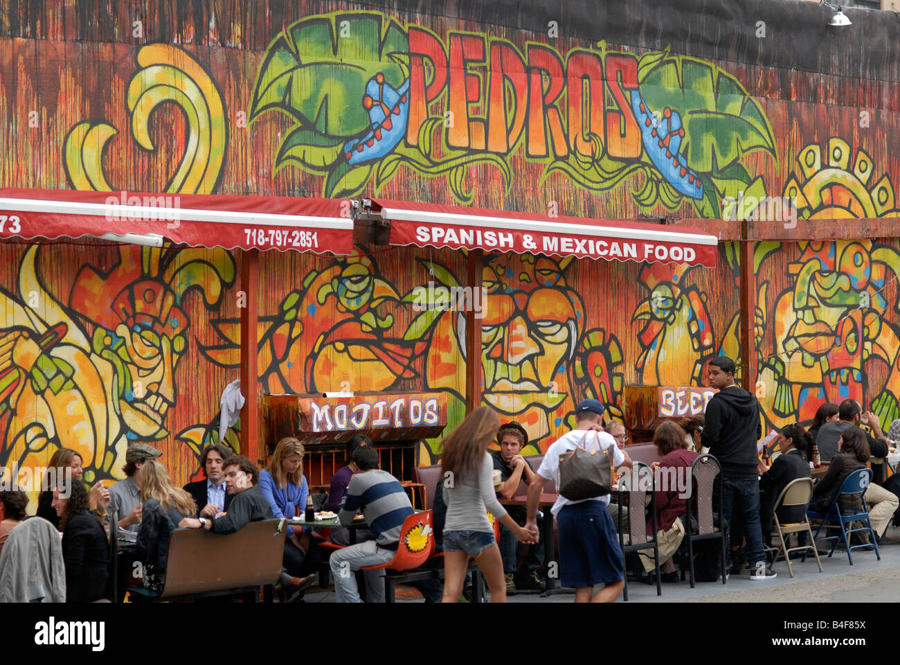 Diners at sidewalk tables at Pedros Spanish and Mexican Food in the trendy Dumbo neighborhood in Brooklyn in New York Stock Photo