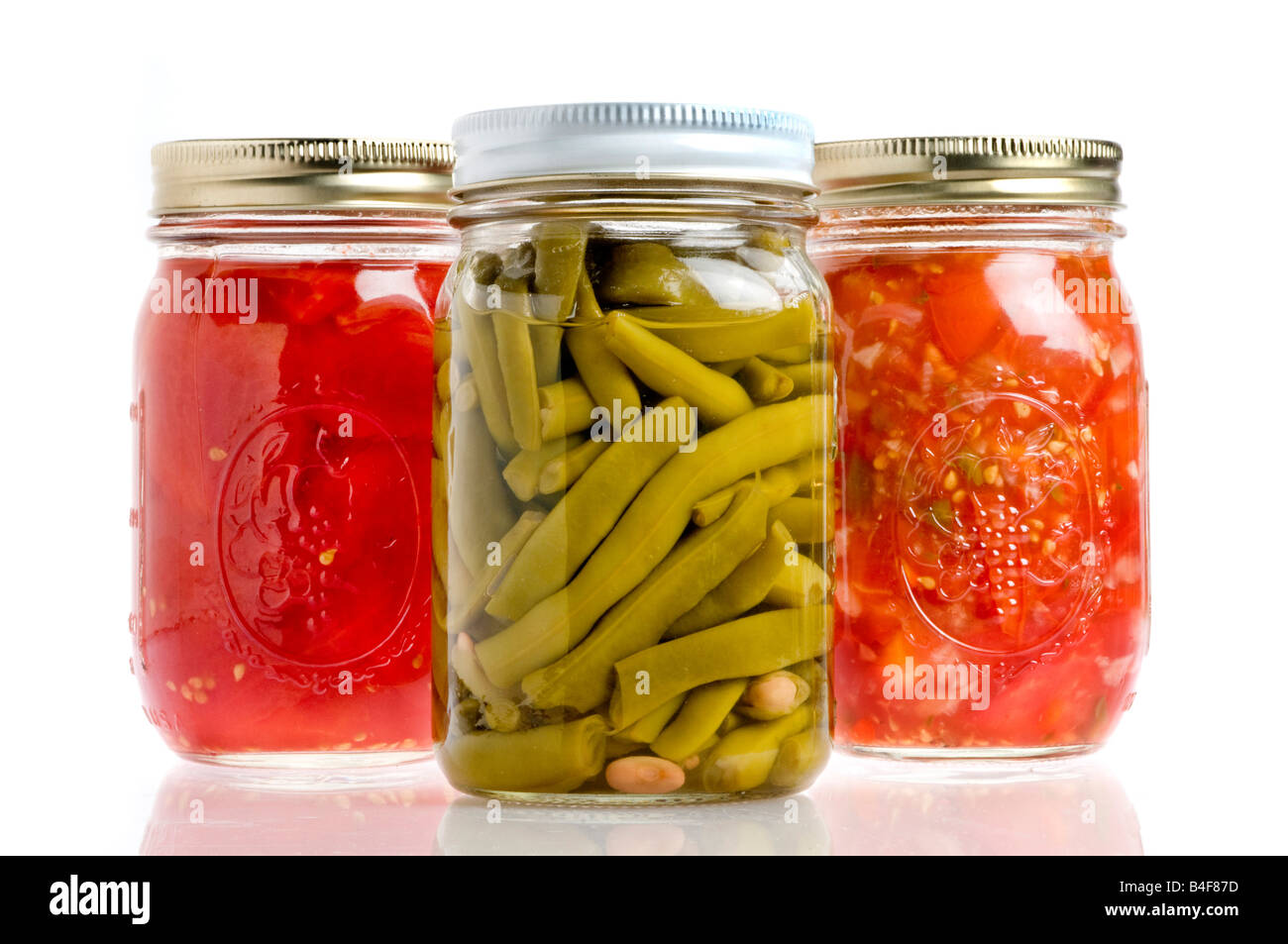 Three jars of canned beans, tomatoes, salsa Stock Photo Alamy