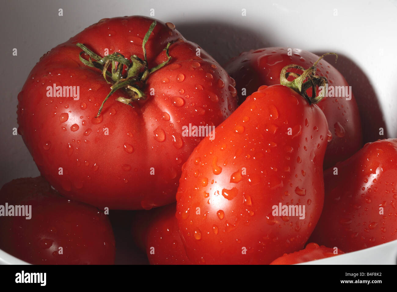 Bowl of fresh Red tomatoes Stock Photo - Alamy