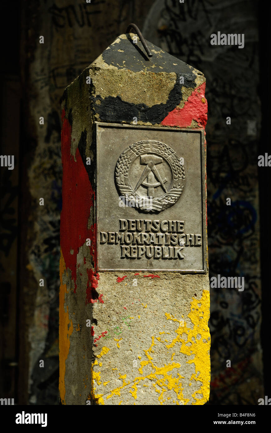 Old Deutsche Demokratische Republik border stone at Checkpoint Charlie Museum, Berlin Stock Photo