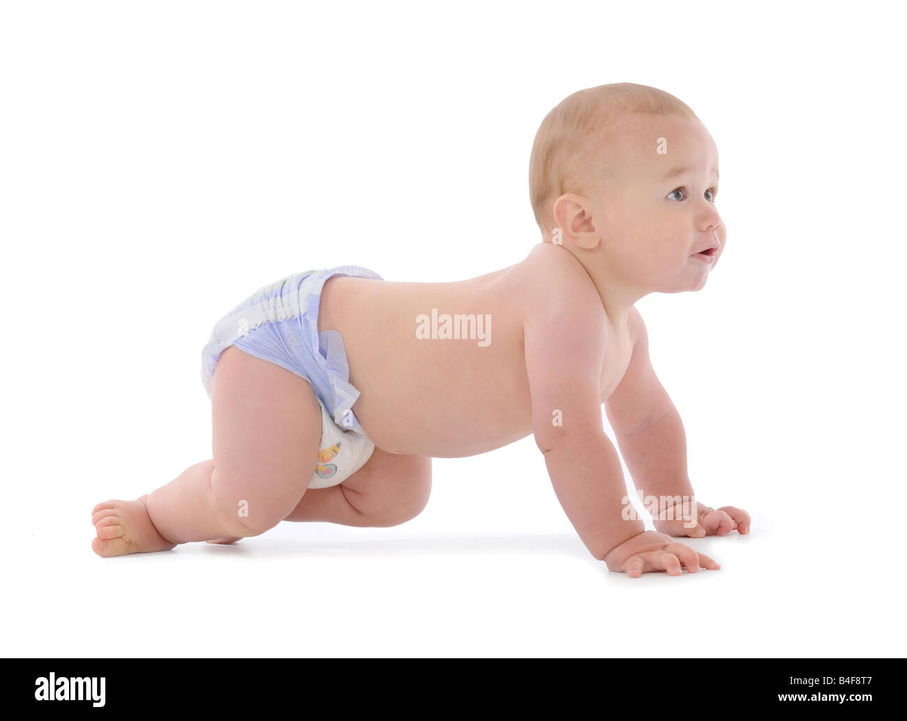 A young baby learning to walk and crawl, babies development in the ...