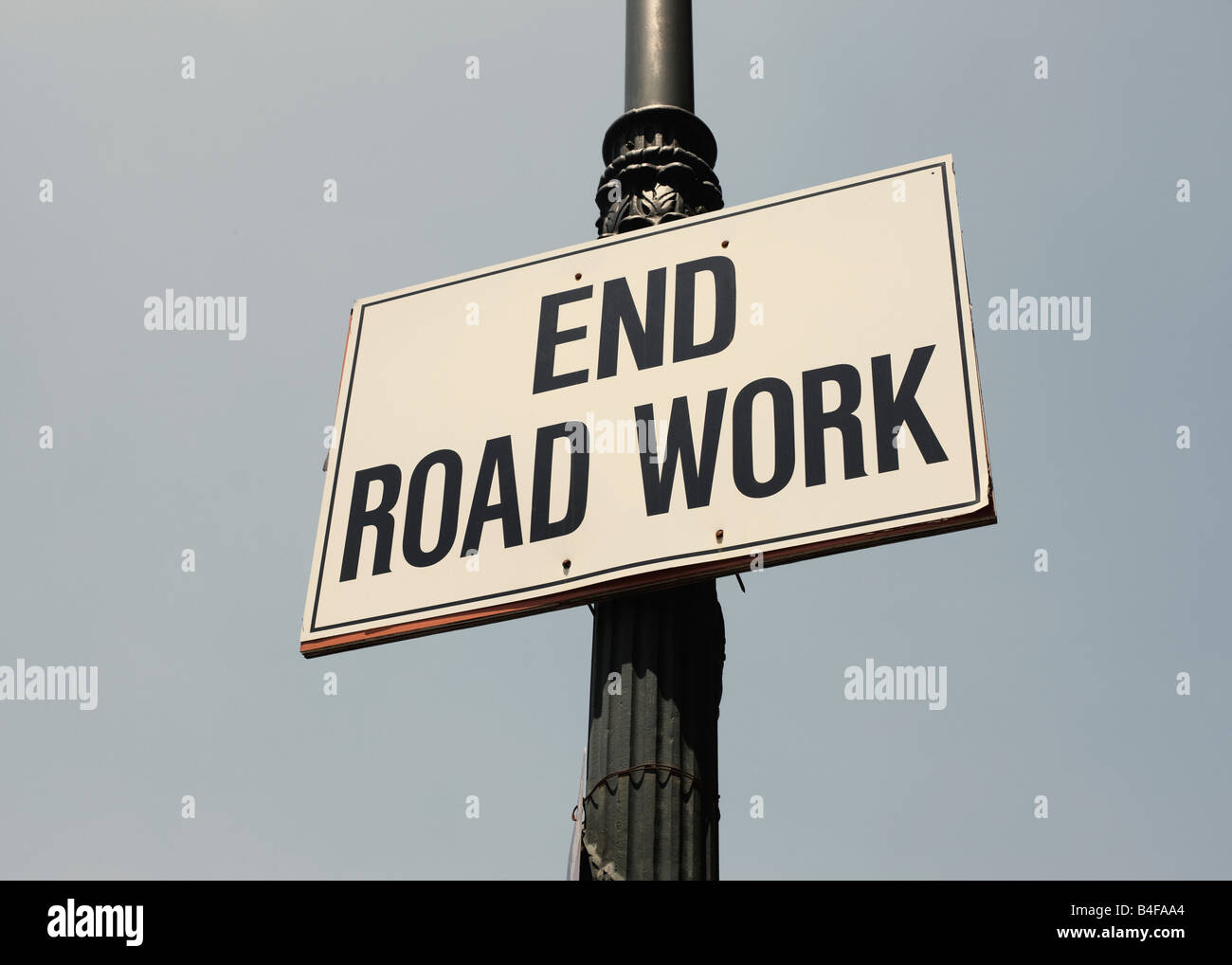 End road work sign informing pedestrians that it is the end of a construction zone fixing the road in Manhattan New York City, New York USA Stock Photo