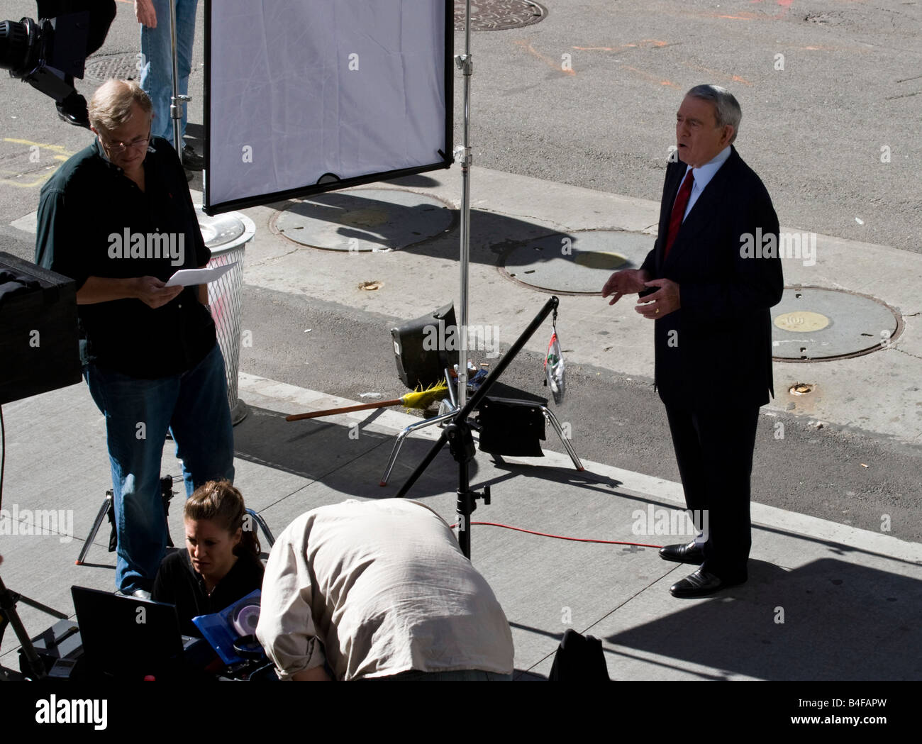 Journalist Dan Rather films a report on Wall Street in New York Stock