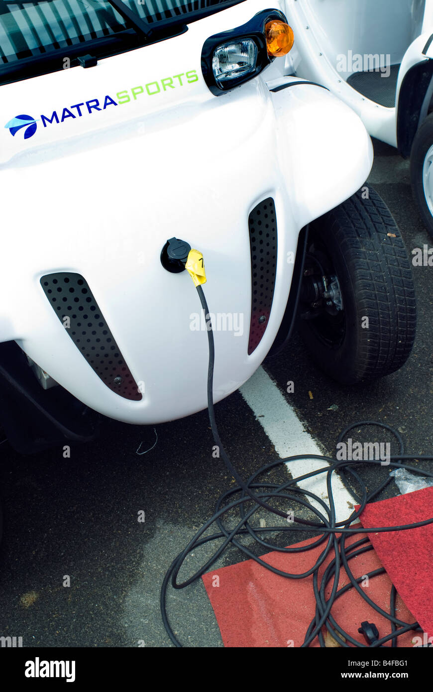 Paris France, Close up, 'Matra Company' Electric Microcar Recharging Outside  Close up Plug-in Ultra Light Vehicle Stock Photo