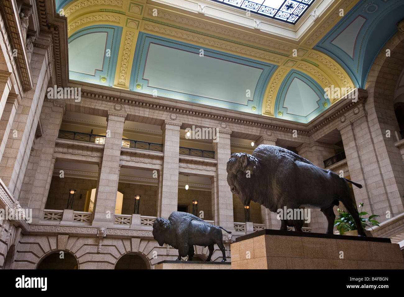 Two life sized bison statues at the base of the Grand Staircase in the Legislative Building, City of Winnipeg, Manitoba, Canada. Stock Photo