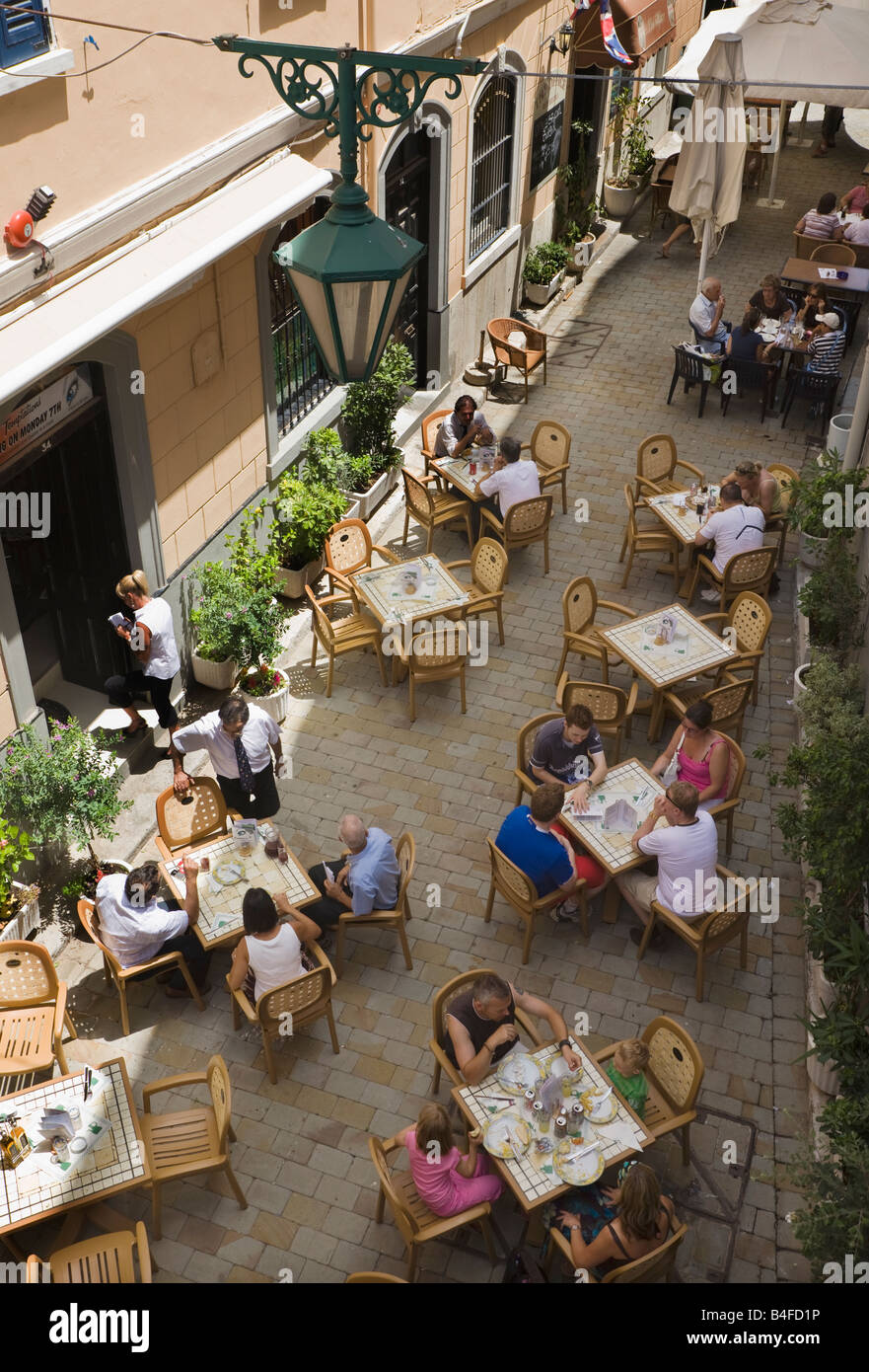 Gibraltar Diners and tables on street outside Temptations restaurant