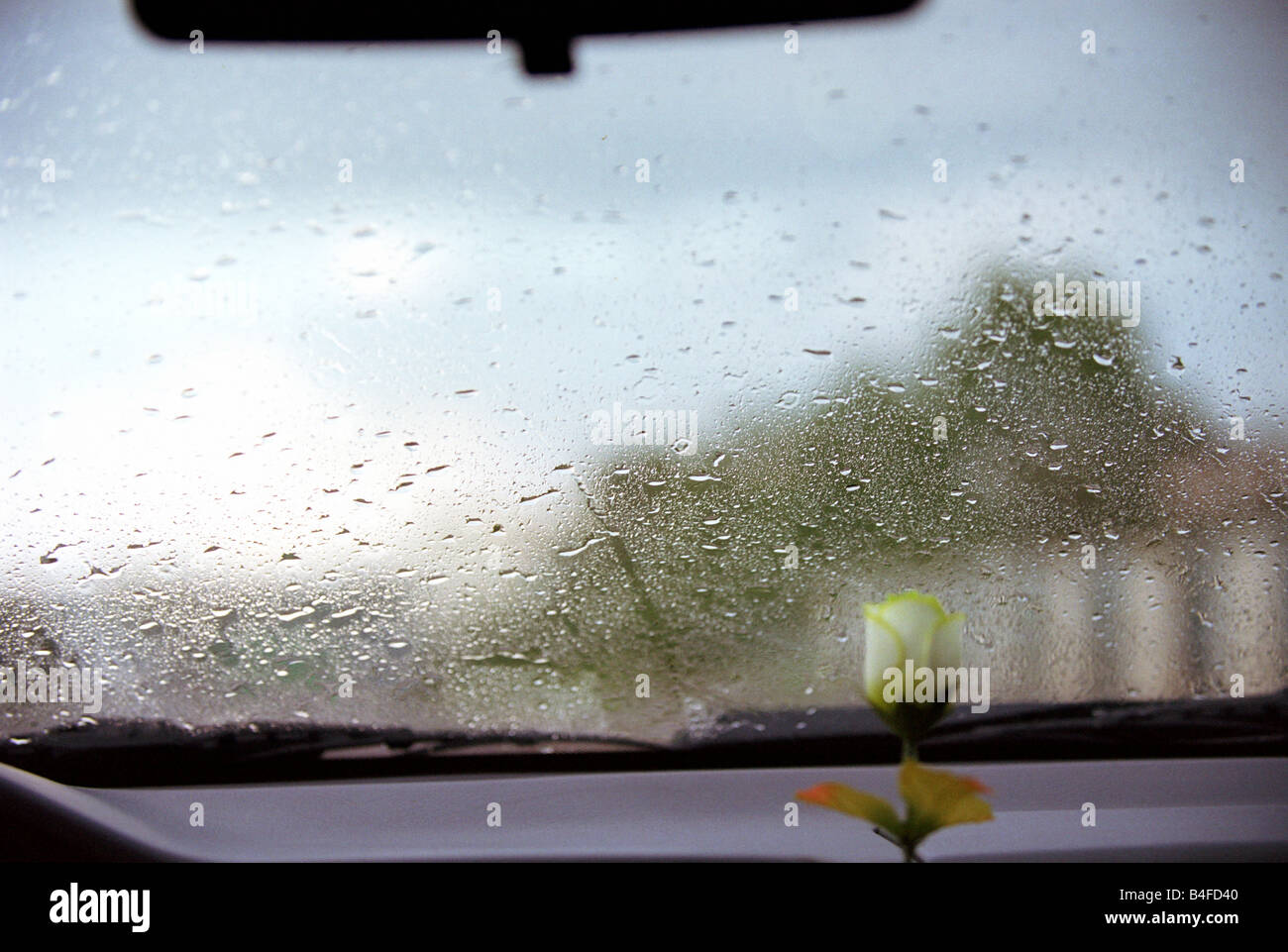Raindrops on the front window of a car Stock Photo