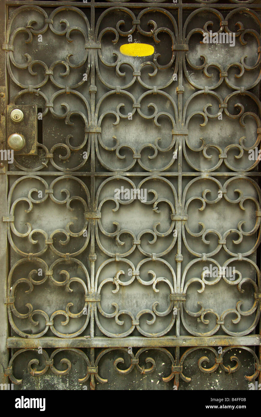 An interesting metal latticework pattern covers a security door in Miami, Florida Stock Photo