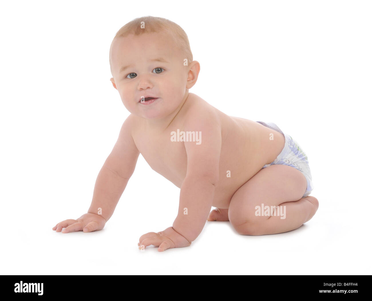 A young baby learning to walk and crawl, babies development in the ...
