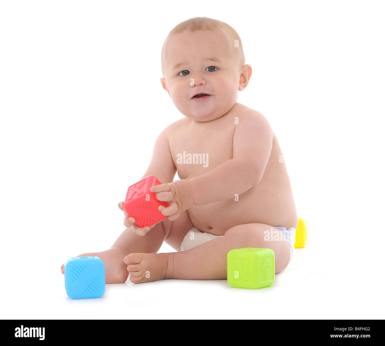 A young baby learning to walk and crawl, babies development in the ...