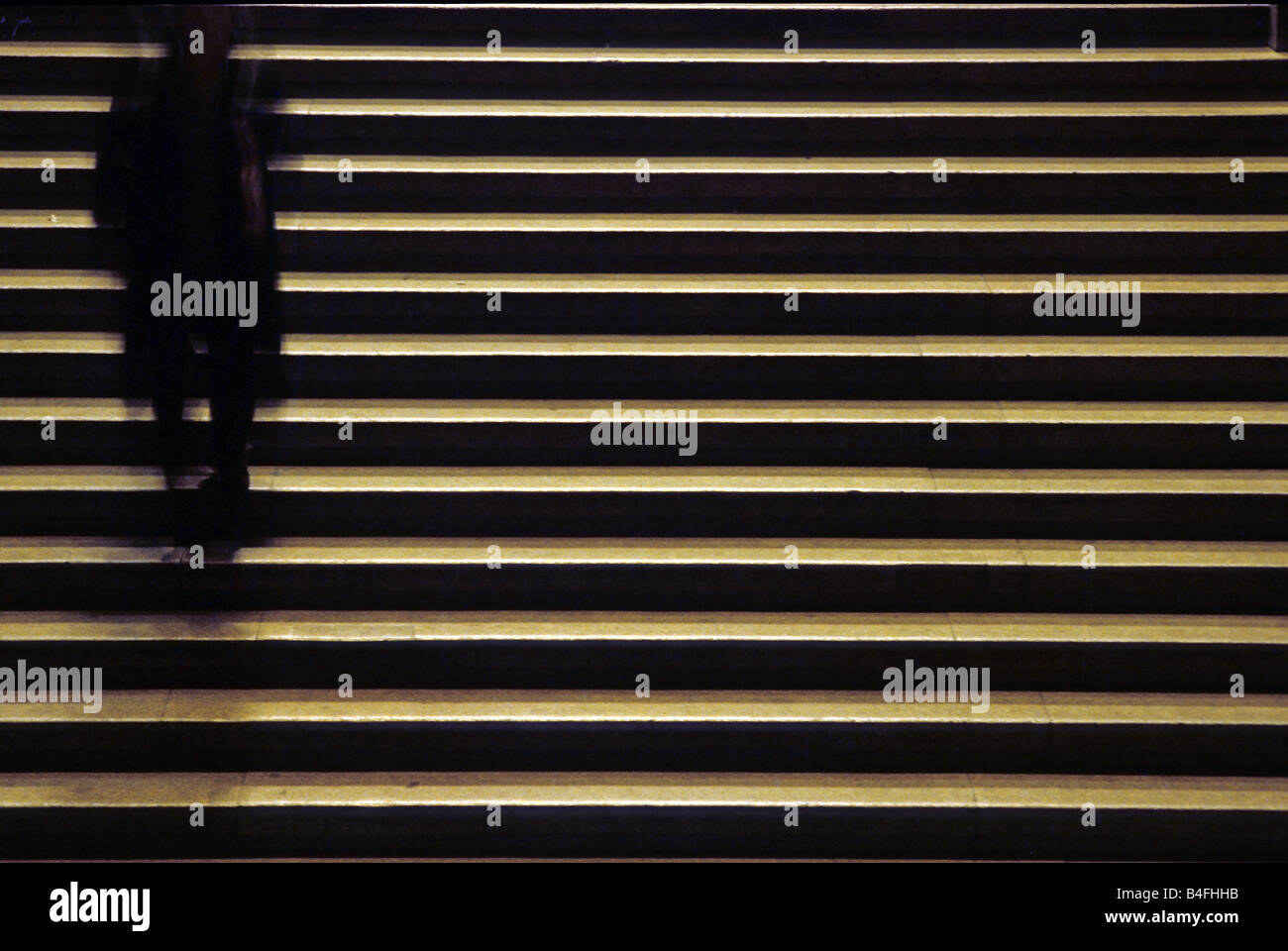 Anonymous shadow going down the stairs Stock Photo