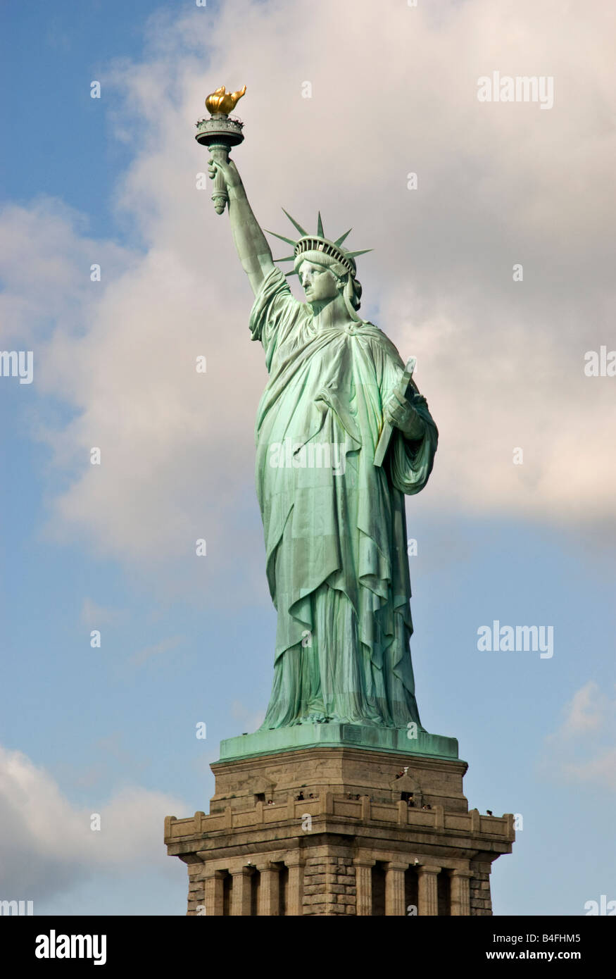 Statue of Liberty on Ellis Island, New York City, New York. Color daytime  landscape photo, statue is in center of frame, ample copy space in sky  Stock Photo - Alamy